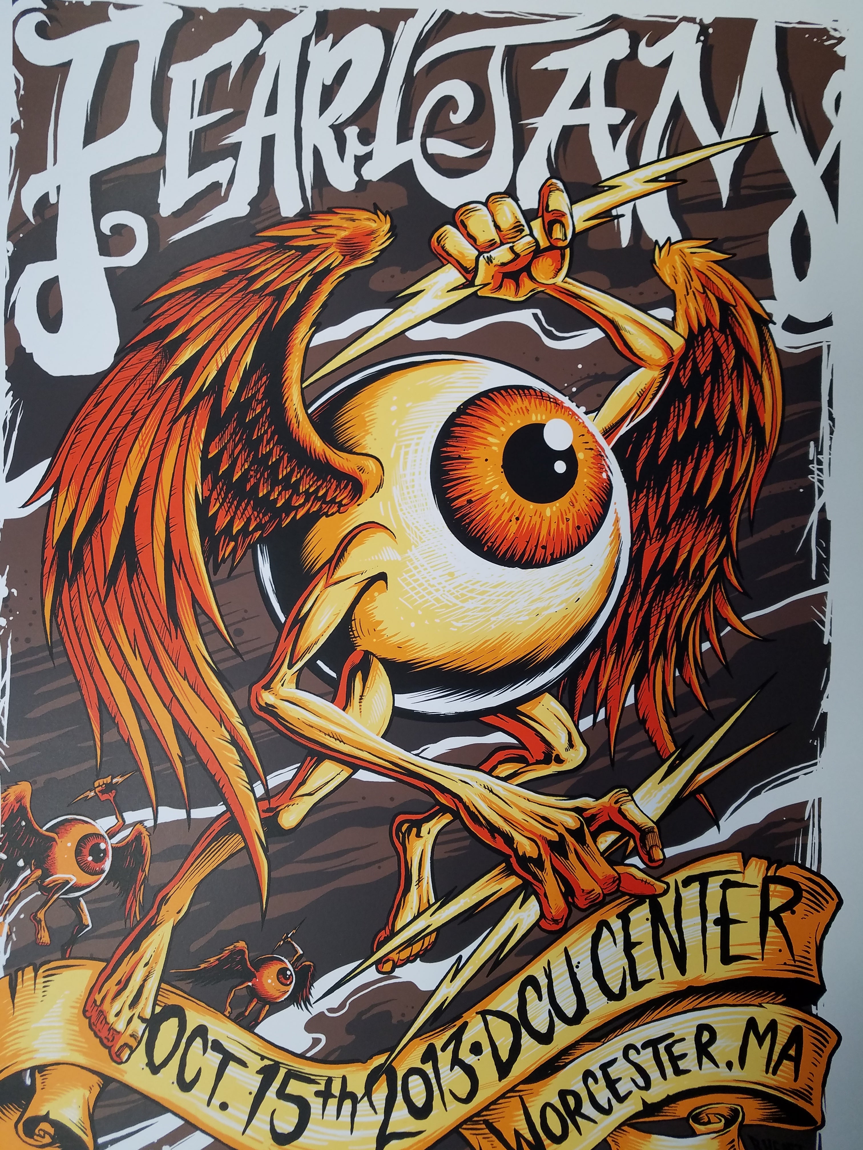 Title:  Pearl Jam - DCU Center 2013 Worcester MA  Artist:  Brandon Heart  Edition:  Limited edition Screen Printed Poster of 100, signed and numbered by the artist  Type:  Screen Print  Size:  18" x 24"  Location:  Worcester, MA  Venue:  DCU Center  Notes:  This beautiful 6-color screen print for Pearl Jam’s October 15th show at the DCU Center in Worcester, MA pays homage to legendary psychedelic poster artist Rick Griffin's "flying eyeball" and remains in perfect condition.
