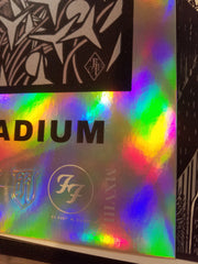 Title: Foo Fighters FOIL VARIANT London Stadium  Artist: Richey Beckett  Edition: Limited edition of 25 AP's, signed by the artist, numbered and embossed  Type: beautifully silk screen printed, 'rainbow foil' stock, including metallic silver ink  Size: 24" x 18"  Venue: London Stadium  Location: England, UK  Notes: Masterfully hand pulled by Prints Of Thieves in England, UK.  **Small blemish on bottom corner, See photos.**  Ready to ship!