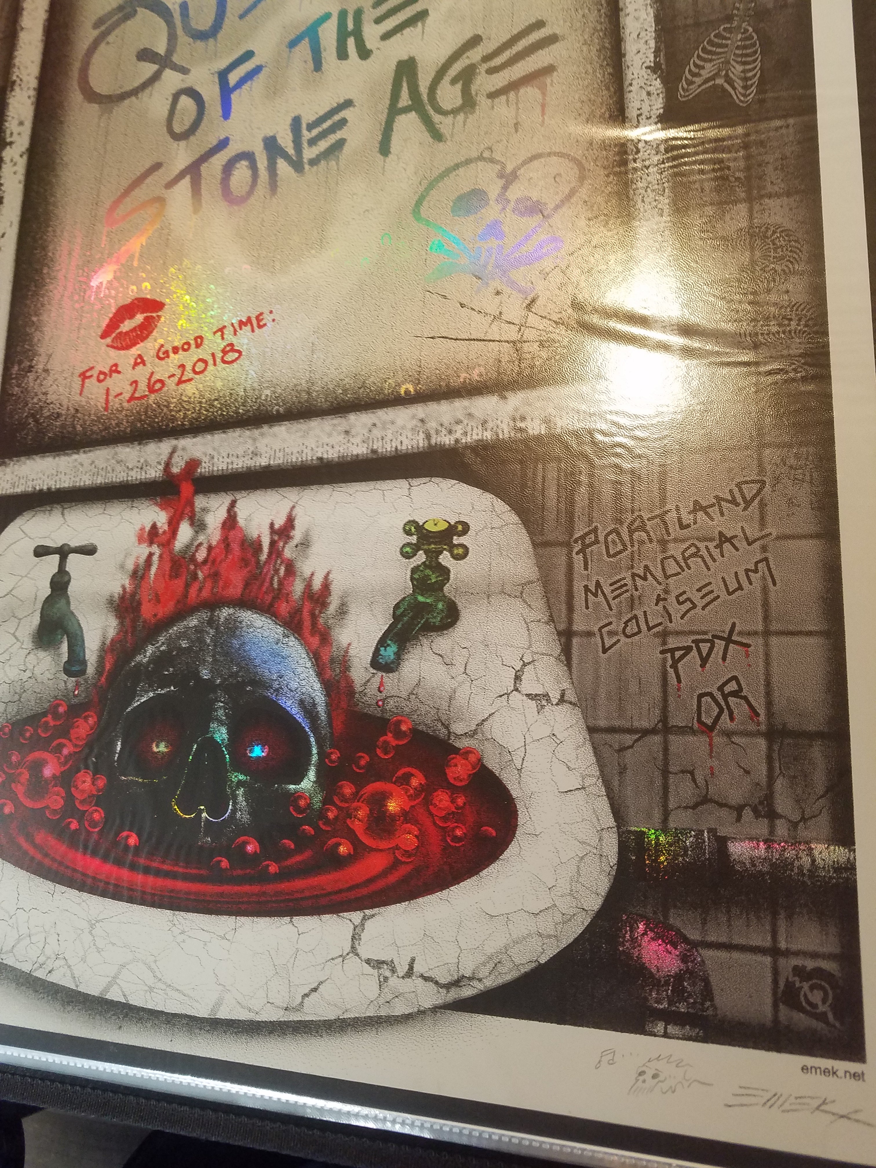 Title: Queens of the Stone Age Mirror Foil (2018)  Artist: EMEK  Edition: 1/26/2018 Limited Edition Screen Printed Poster of 450, signed and numbered by the artist.  Type: Rainbow Foil Mirror Holographic Paper with Glow-In-The-Dark Inks  Size: 18" X 24"  Location: Portland, OR  Venue: Portland Memorial Coliseum