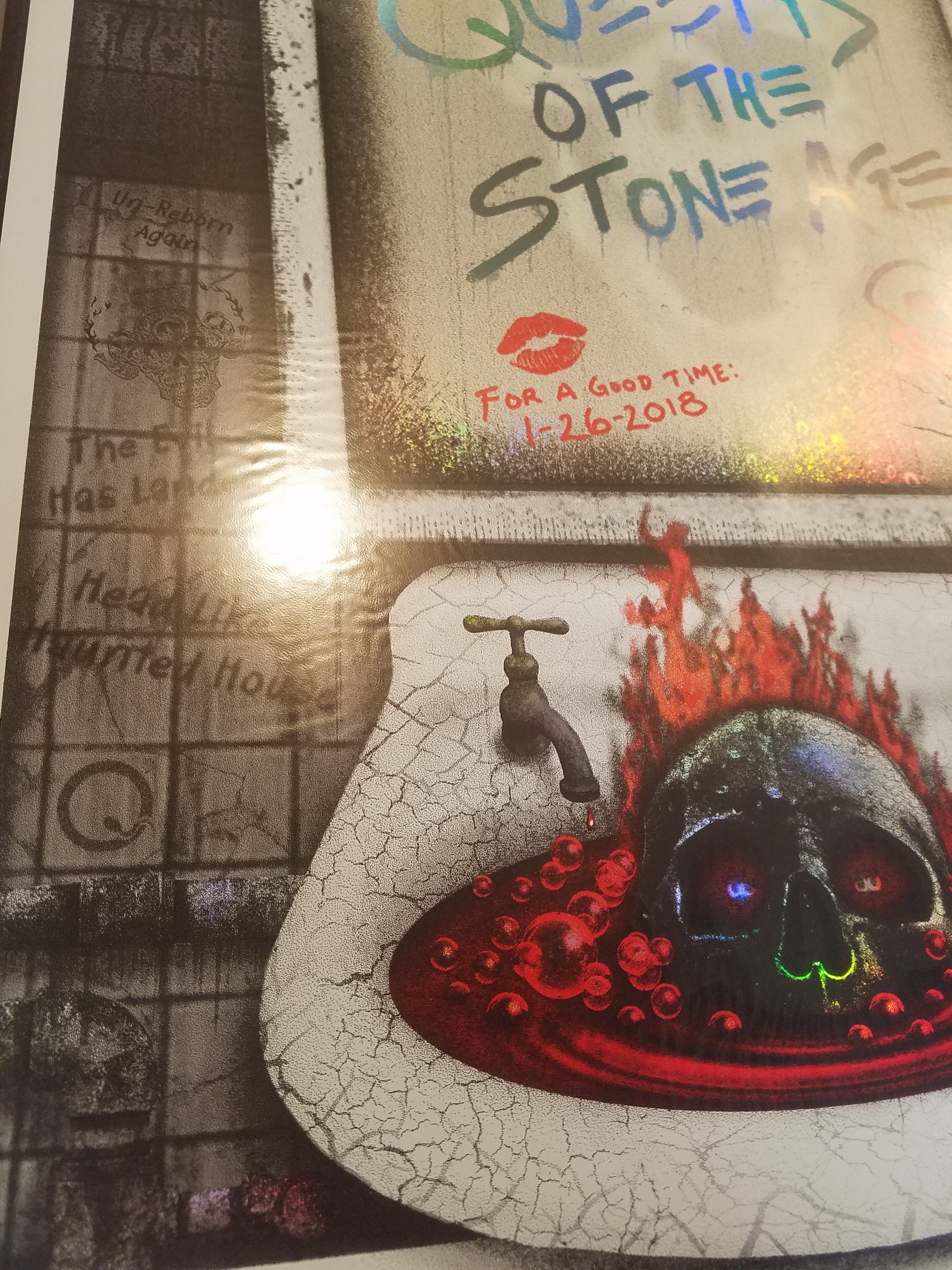 Title: Queens of the Stone Age Mirror Foil (2018)  Artist: EMEK  Edition: 1/26/2018 Limited Edition Screen Printed Poster of 450, signed and numbered by the artist.  Type: Rainbow Foil Mirror Holographic Paper with Glow-In-The-Dark Inks  Size: 18" X 24"  Location: Portland, OR  Venue: Portland Memorial Coliseum