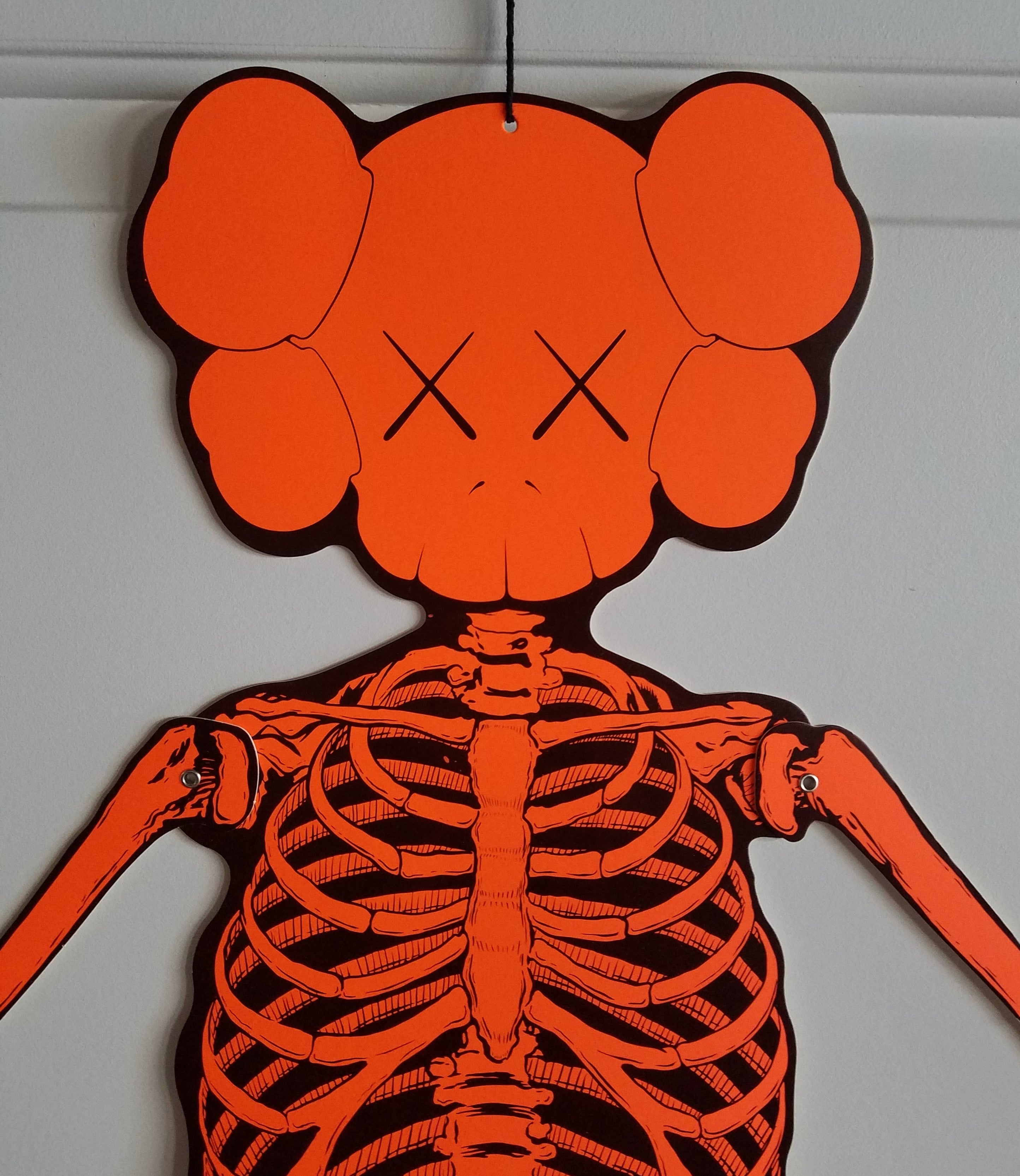 KAWS Skeleton Cardboard Wall Hanging - Orange