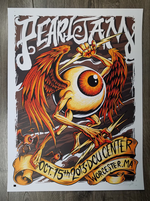 Title:  Pearl Jam - DCU Center 2013 Worcester MA  Artist:  Brandon Heart  Edition:  Limited edition Screen Printed Poster of 100, signed and numbered by the artist  Type:  Screen Print  Size:  18" x 24"  Location:  Worcester, MA  Venue:  DCU Center  Notes:  This beautiful 6-color screen print for Pearl Jam’s October 15th show at the DCU Center in Worcester, MA pays homage to legendary psychedelic poster artist Rick Griffin's "flying eyeball" and remains in perfect condition.