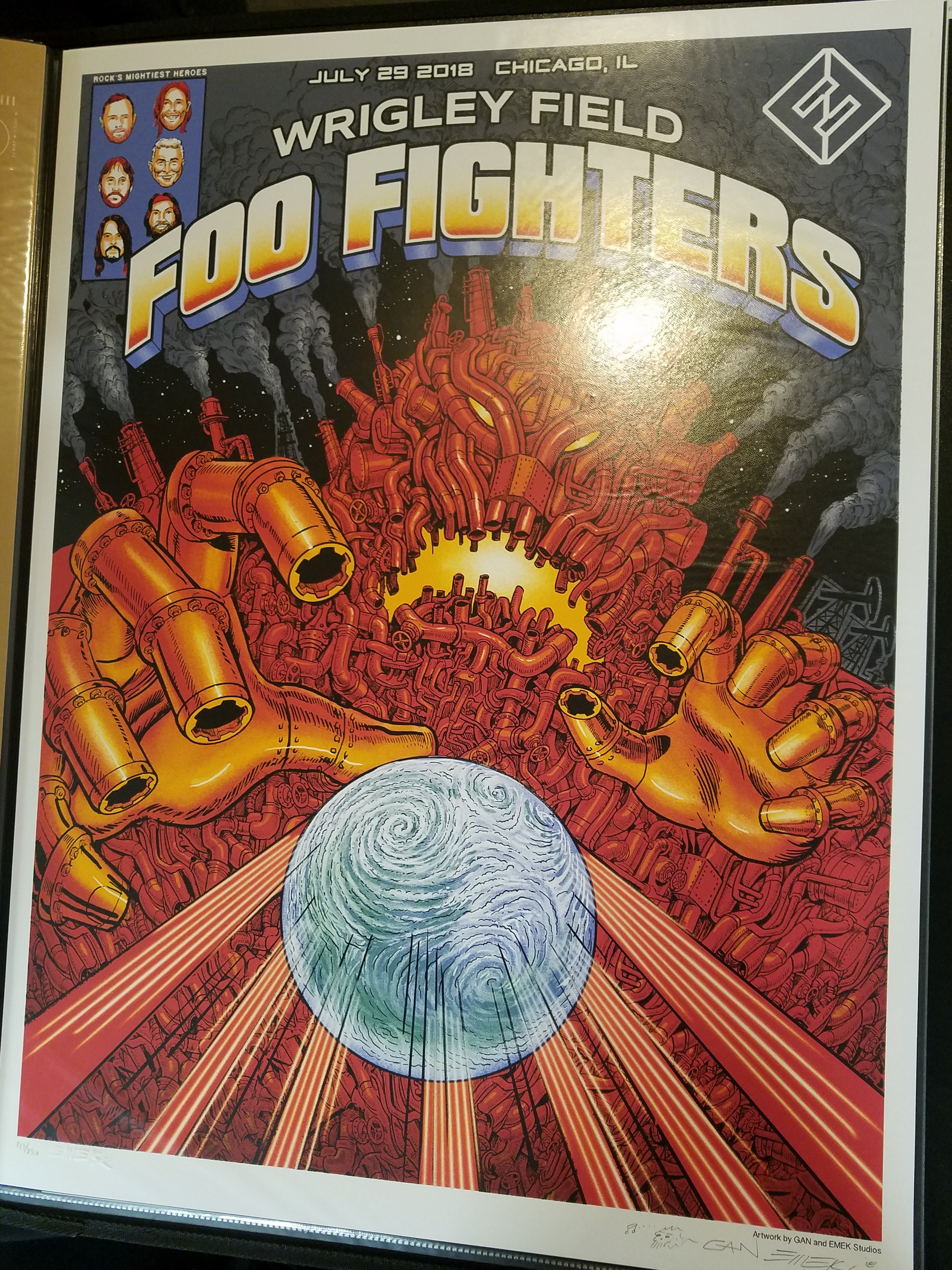 Title:  Foo Fighters Emek Wrigley Field July 29th, 2018  Artist:  Emek and his brother 'Gan'  Edition:  xx/850  Size:  18" x 24"  Venue:  Wrigley Field  Location:  Chicago, IL  Notes:   Signed by both artists.  750 prints were originally sold at the show. embossed and doodled.  This print is edition #100 or lower.  This poster is a collaboration with Emek's brother 'Gan' for the Foo Fighters show which took place at Wrigley Field in Chicago, IL on July 29, 2018.