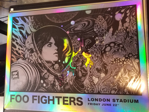 Title: Foo Fighters FOIL VARIANT London Stadium  Artist: Richey Beckett  Edition: Limited edition of 25 AP's, signed by the artist, numbered and embossed  Type: beautifully silk screen printed, 'rainbow foil' stock, including metallic silver ink  Size: 24" x 18"  Venue: London Stadium  Location: England, UK  Notes: Masterfully hand pulled by Prints Of Thieves in England, UK.  **Small blemish on bottom corner, See photos.**  Ready to ship!