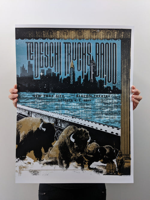 Title: Tedeschi Trucks Band - NYC - 2019 (Full triptych sets available)  Edition: Limited Edition, Signed and numbered APs.  Type:  Five color limited edition triptych is printed full bleed so that all three posters can be framed/hung together as shown in the image.  Gold metallic and glow in the dark ink add special print touches  Size: Full triptych size: 54” x 24”  Individual poster size: 18” x 24”  Notes:  **THESE PRINTS ALL SOLD OUT IN NEW YORK**