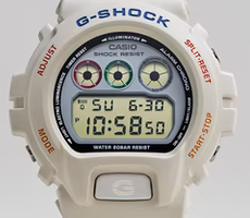 Title:   G-SHOCK Ref. 6900-PT80 By John Mayer  Color:  Off-white with red, green and grey accents.   Features:  Colorway that references the mid-1980's classic Casio PT-80 keyboard. Resin case with a modern look. Legendary "Triple Graph" display. Stylish retro vibes in a lighthearted package. 