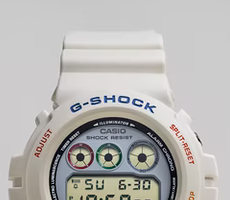 Title:   G-SHOCK Ref. 6900-PT80 By John Mayer  Color:  Off-white with red, green and grey accents.   Features:  Colorway that references the mid-1980's classic Casio PT-80 keyboard. Resin case with a modern look. Legendary "Triple Graph" display. Stylish retro vibes in a lighthearted package. 