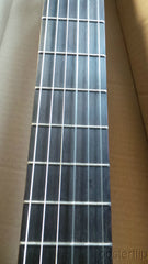 Yamaha nylon-string acoustic guitar autographed by acoustic guitar duo Rodrigo y Gabriela.