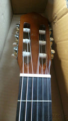 Yamaha nylon-string acoustic guitar autographed by acoustic guitar duo Rodrigo y Gabriela.