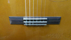 Yamaha nylon-string acoustic guitar autographed by acoustic guitar duo Rodrigo y Gabriela.