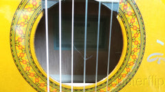 Yamaha nylon-string acoustic guitar autographed by acoustic guitar duo Rodrigo y Gabriela.